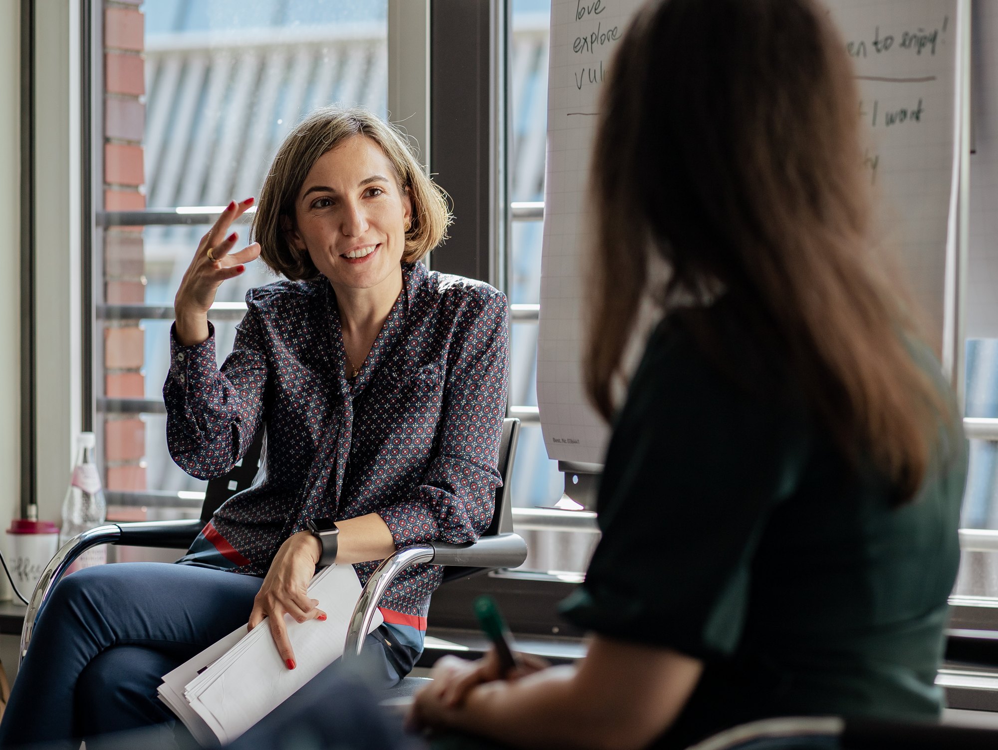 Two managers practicing a conversation in a leadership skills module